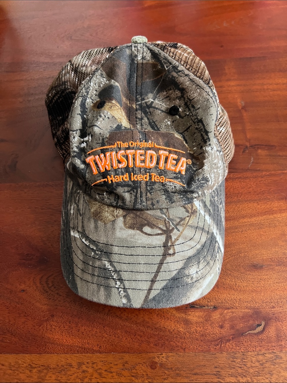 Twisted tea camo trucker hat.